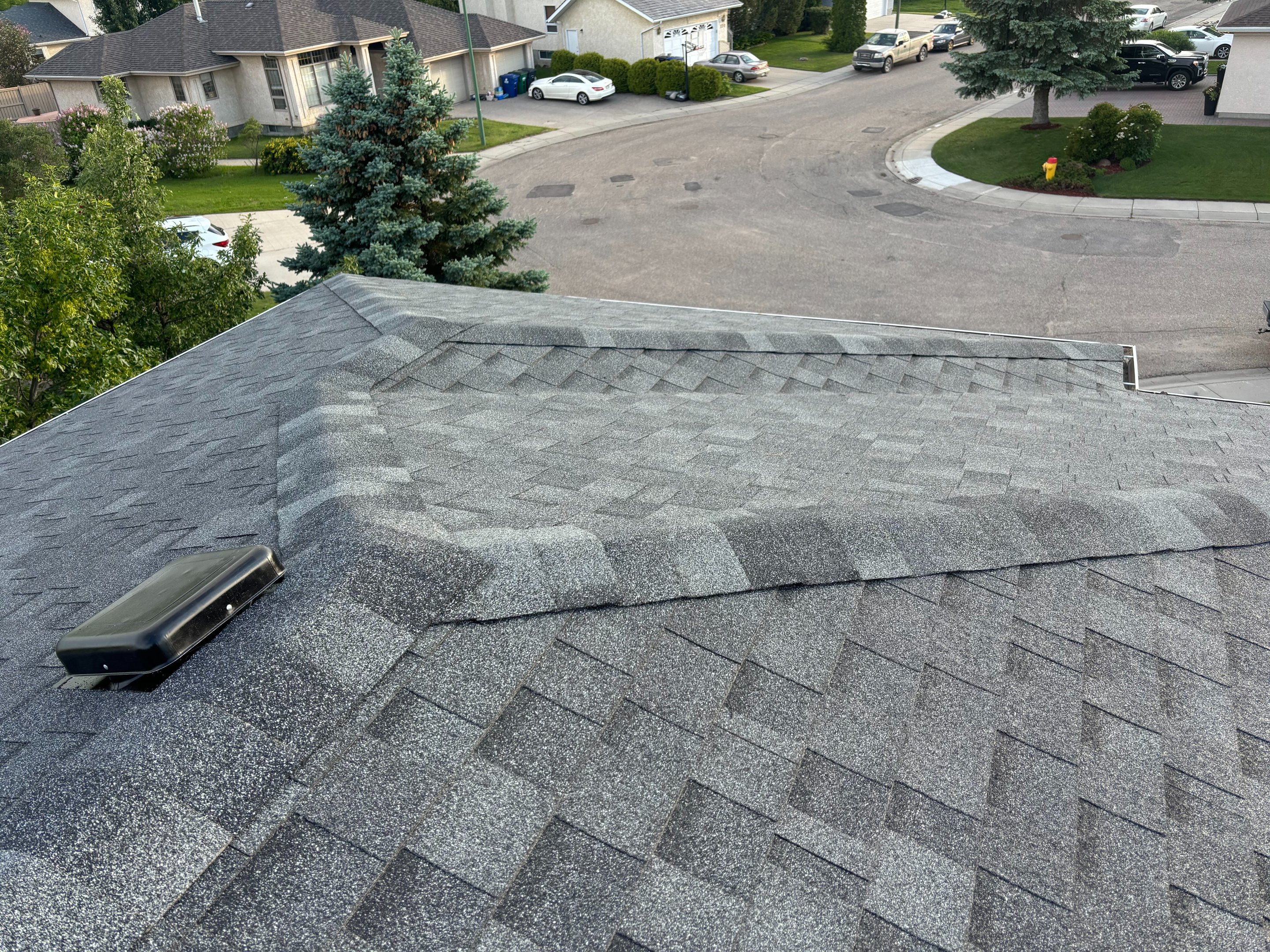 Close-up of new architectural asphalt shingles installed by No Stress Roofing