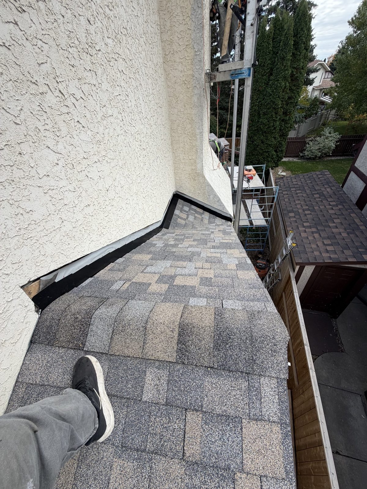 Close-up of new asphalt shingles installed by No Stress Roofing