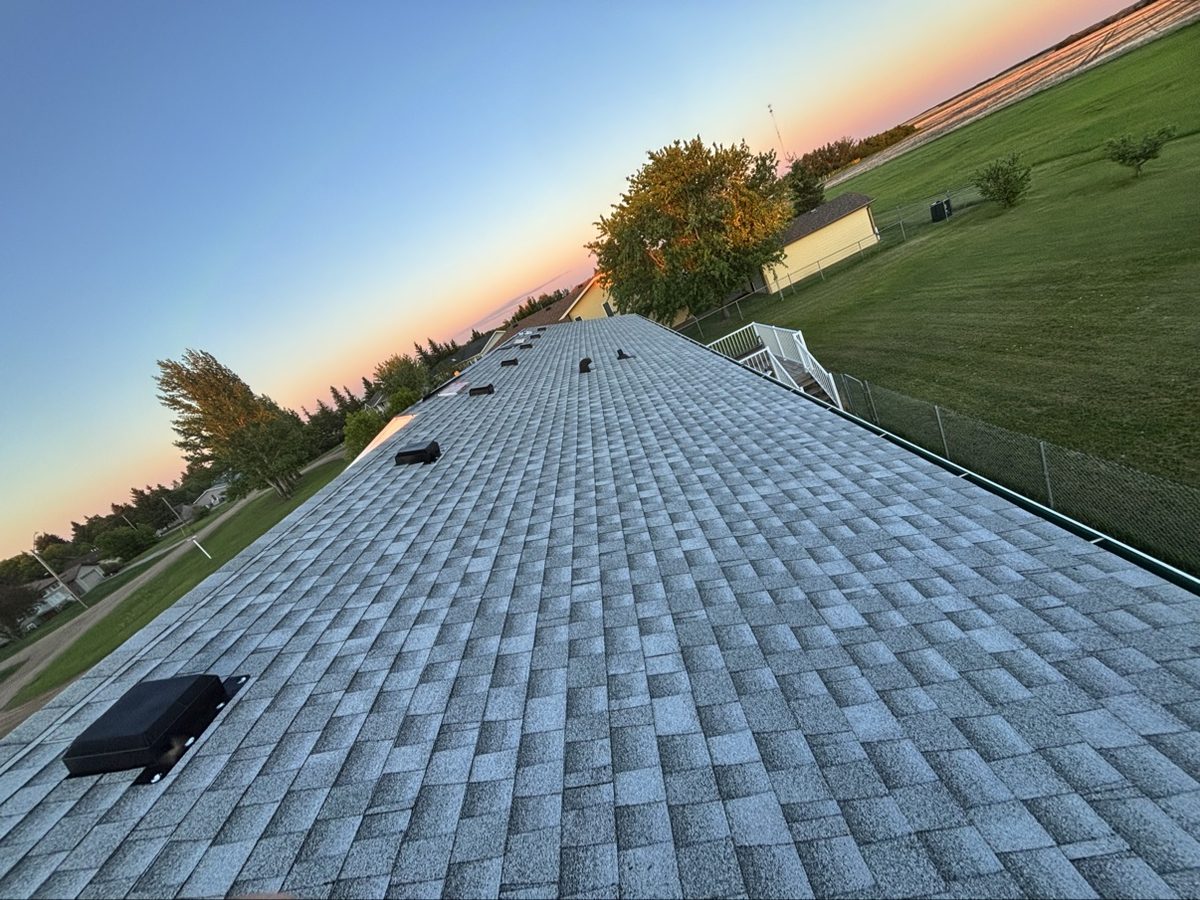 New roof at sunset installed by No Stress Roofing