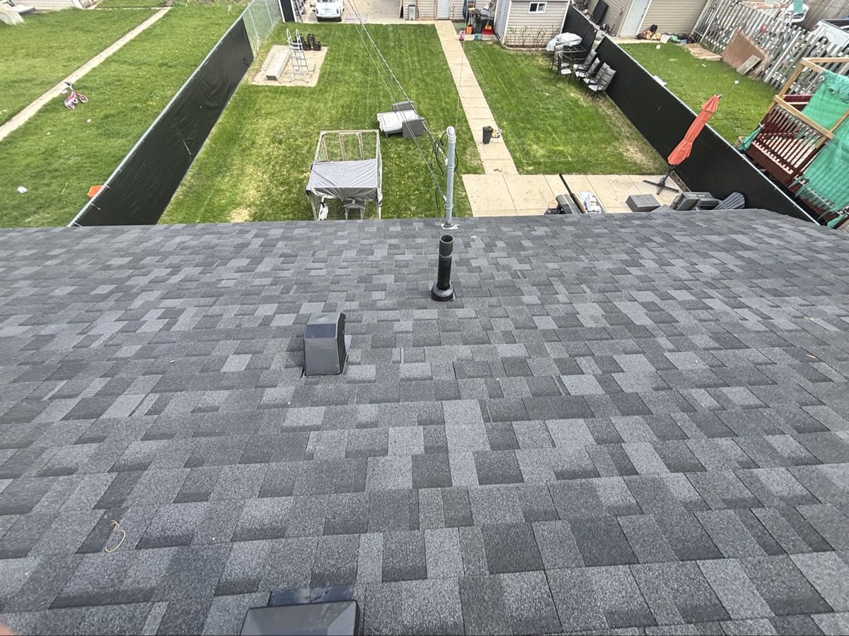 New shingle roof over a Saskatoon backyard by No Stress Roofing